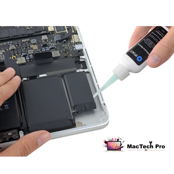 Old MacBook battery and adhesive removed cleanly on an ESD-safe bench in Dubai — MacTech Pro