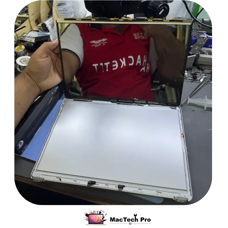Bezel removal and cutting the internal screen adhesive tape on a MacBook display with SOFIX S-F401 tools — MacTech Pro Dubai