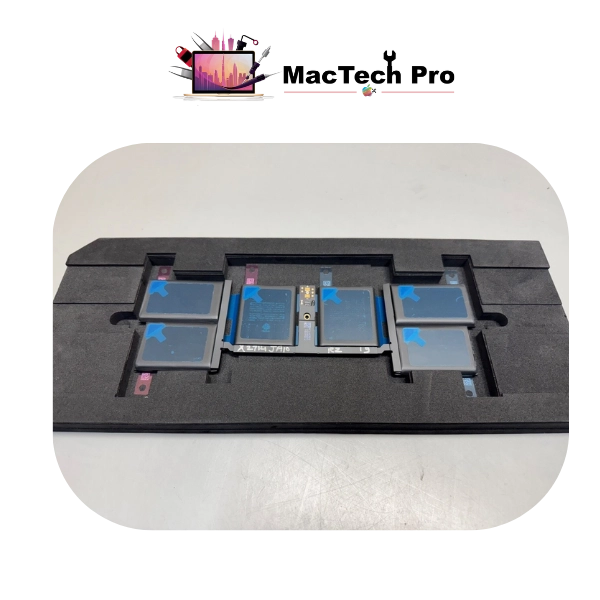 Fresh full-capacity A2992 battery fitted on an ESD-safe bench — MacTech Pro Dubai